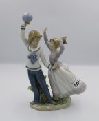 Lladro figure of boy and girl: (boys hand re-stuck).