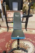 A Men's Health Active + branded weight training bench with preacher curl attachment and set of vinyl