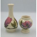 Moorcroft Magnolia on cream vase : and bud vase. Height of tallest 15.5cm