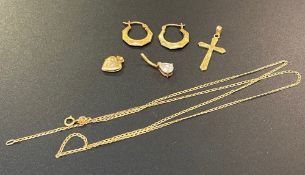 A collection of 9ct gold jewellery: to include necklace, cross pendant, belly bar, pair of ear rings