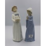 2 x Nao figures: boy carrying books and a girl crying.