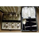 Cased set of six silver tea spoons: together with cased spoon and pusher. Total weight 89.9grams