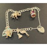 Silver charm bracelet: 18g total weight.