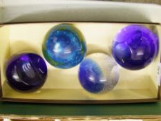 Four paperweights: to include two Caithness
