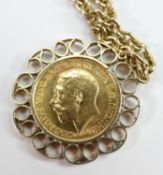 Gold full sovereign dated 1914 in 9ct gold mount and 9ct chain: overall weight 32.7g.