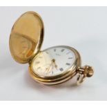 Gold plated Waltham full hunter pocket watch: in ticking order.