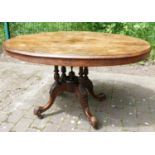 Victorian walnut tip top loo table: Measuring 131cm x 96cm x 73.5cm.