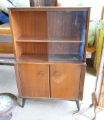 Mid-century Mahogany Cabinet. Sliding glazed compartment to top, cupboard below containing