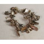 Silver charm bracelet with large quantity of charms: Some marked sterling, .925, hallmarked, ,800,