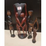 Four African hardwood hand carved stylised figures: tallest 41cm in height.