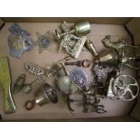 A mixed collection of metal ware items to include: vintage AA badge, brass and copper bells,