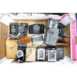A collection of vintage 35mm film camera including: Halina 35x, Kodak Brownie bellows camera's,