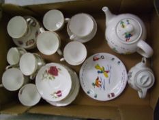 A mixed collection of teaware items: including Royal Stafford, Wade teapot and collectors plate