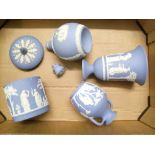 A collection of Wedgwood blue jasperware items to include: Portland vase, decanter, lidded pot (a/
