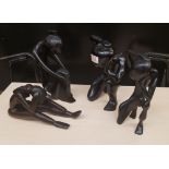 Four African hardwood hand carved stylised figures: tallest 29cm in height.