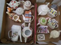 A collection of teapots: including 2 Wade examples (2 trays).