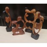 Four African hardwood hand carved stylised figures: tallest 28cm in height.