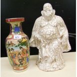 A large ceramic Buddha figure: together with an Oriental vase (2).