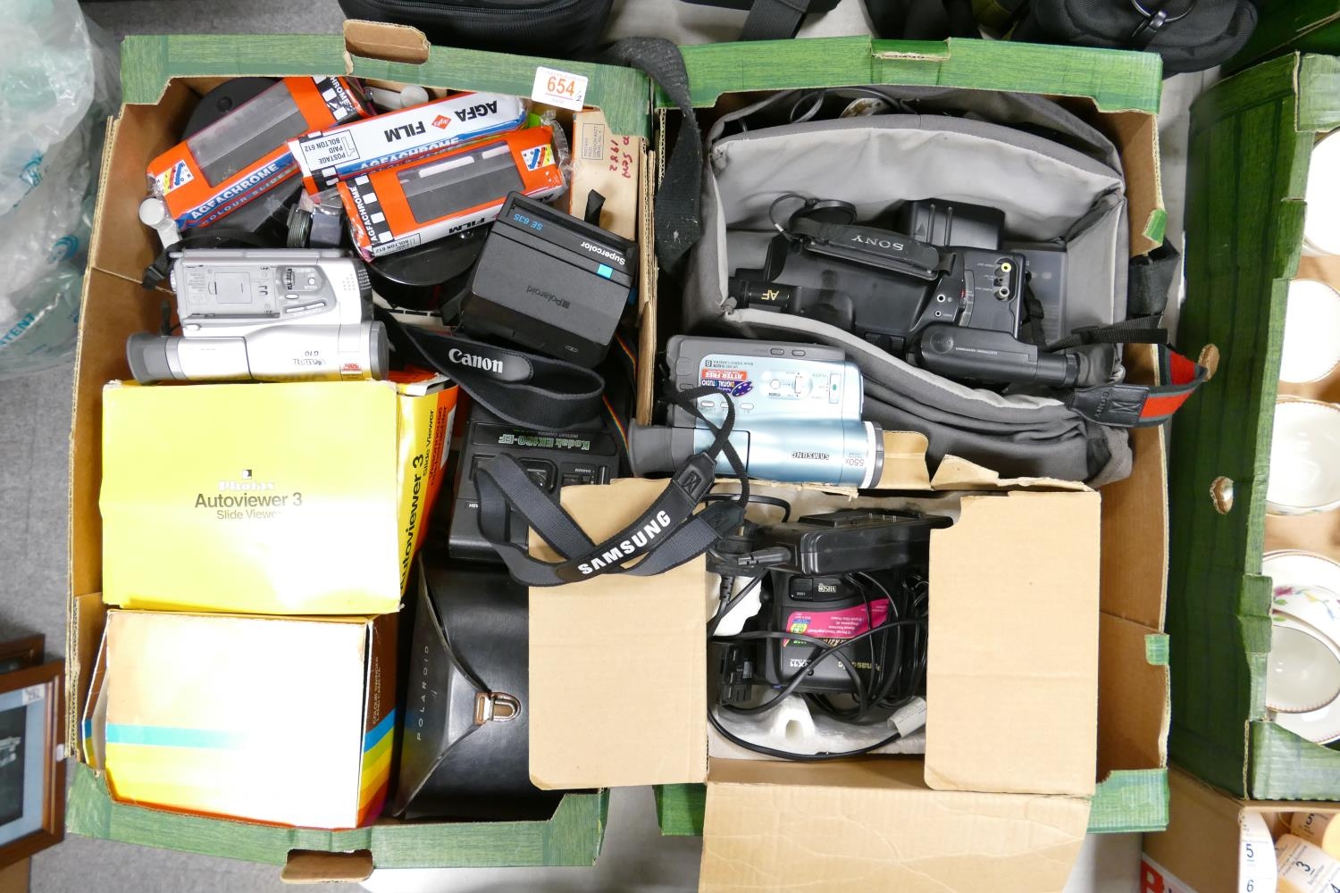 A mixed collection of camera equipment to include Kodak & Polaroid Instant Cameras, Sony & Panasonic