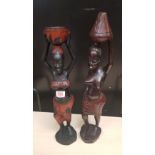 Two large African hardwood hand carved figures of tribal ladies carrying food/water: tallest 58cm in