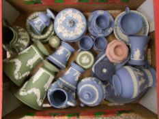 A collection of Wedgwood Jasper ware to include: pair of green flared vases, blue coffee cans, jugs,