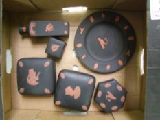 A collection of Wedgwood terracotta on black Egyptian theme items: (1 tray).