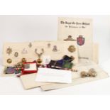 A good collection of military related items: Including cap badges, brass military buttons, various