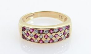 9ct gold hallmarked ruby & diamond ring: Ring size R, weight 4.4g. Marked as having .33ct of