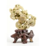 Large Soap stone figure of Lion dogs chasing clouds: Pierced ball section centrally, height 27cm