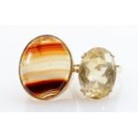 Two gem set 9ct gold rings banded Agate & Topaz: Both marked 9ct and tested as 9ct gold. Gross