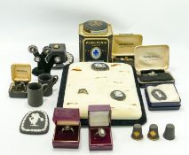 A collection of black Wedgwood jewellery & miniatures to include: Rings, brooches, thimbles,