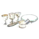 A collection of silver items: Including salts, serviette rings and enamelled mirror, solid silver