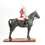 Beswick Connoisseur Lifeguard on Horse: 2562 on wooden plinth.