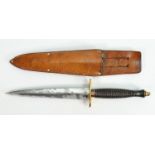 Fairbairn Sykes style bronze fighting knife: With brass hilt, in leather sheath, overall length 31.