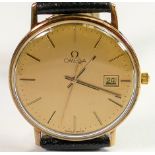 Omega 9ct gold gentlemans date quartz wristwatch: With leather strap in original box.