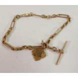 Victorian 9ct gold watch chain with T-bar and medal: 33.4g.