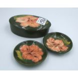 Moorcroft Hibiscus on green lidded pot : together with two small pin dishes (3)