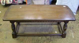 Carved oak Priory style coffee table: table length 102cm.