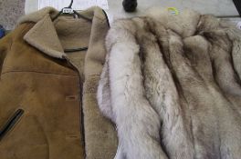 A Taube vintage sheepskin ladies coat: together with a faux fur jacket (2).