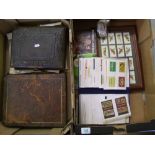 A mixed collection of items to include: framed tea cards, matchbook collection in binder,