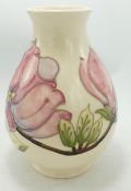 Moorcroft Magnolia vase: on cream background. Height 19cm