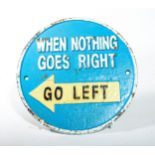 A Cast Iron AB Tools 'when nothing goes right go left' Wall Plaque