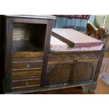 Priory style oak telephone/hall seat, with carved lion arm rest.