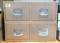 small metal bank of drawers