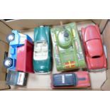 A collection of British and Japanese vintage toy cars including large clockwork tin plate tank ,