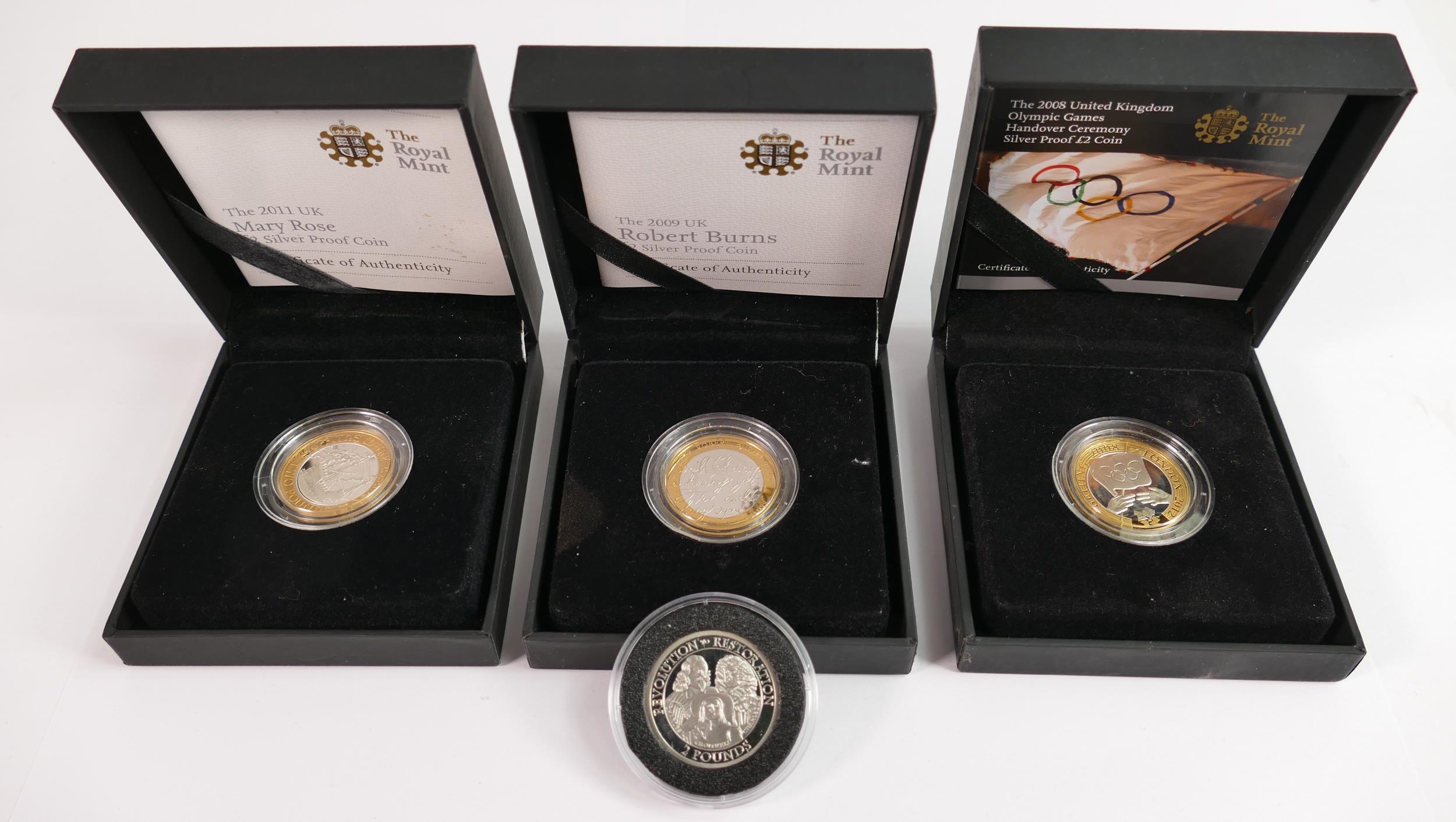 A collection of Royal Mint silver proof £2 coins: comprising 2009 Robert Burns, 2011 Mary Rose,