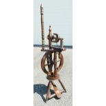 An Oak Georgian style foot operated Spinning Wheel. Approx 50cm Tall.