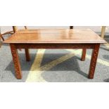 A small oak coffee table with geometric carvings 91cm High 44cm W