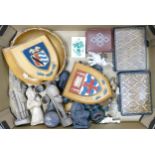A collection of items to include, leather covered cigarette cases, carved wooden figure, heraldic