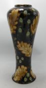 Cobridge stoneware vase decorated with leaves: Dated 2003, height 30cm